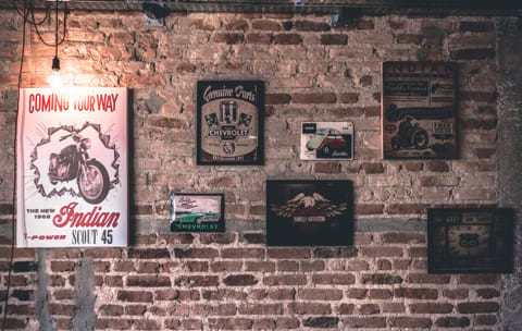 painted brick wall with paintings