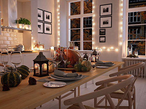 A fresh interior decorated for the holidays with a turkey served on the dining table.