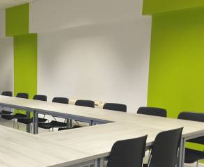Freshly painted white and green walls in a commercial conference room in Chicago.