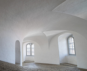 Inside of an industrial building that has been painted white.