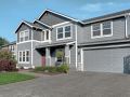 Large two story house with the exterior of the first floor painted a brighter shade of blue than the second.