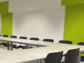 Freshly painted white and green walls in a commercial conference room in Chicago.