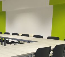 Freshly painted white and green walls in a commercial conference room in Chicago.